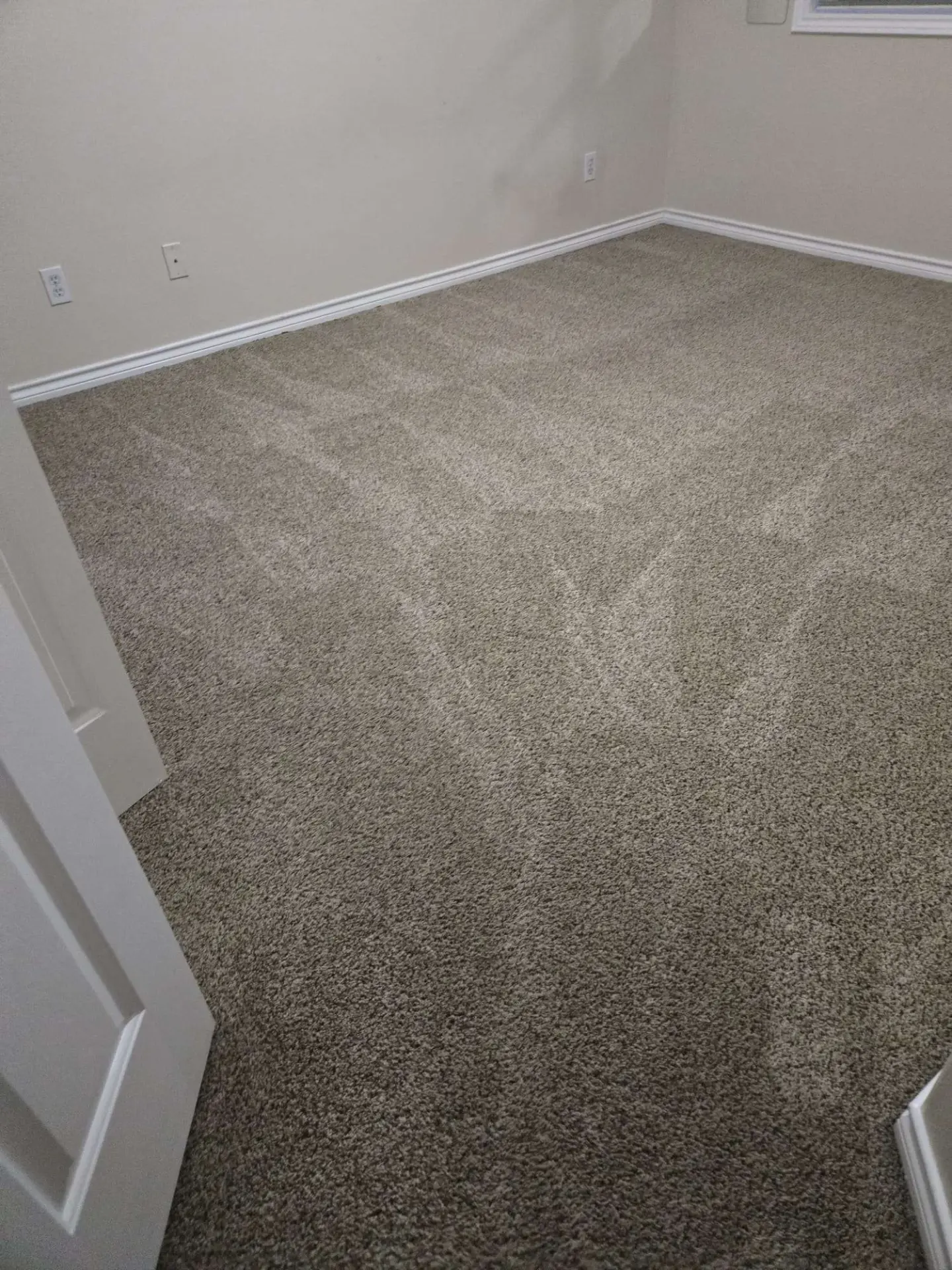 Freshly cleaned bedroom carpet with fresh vacuum lines